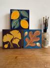 three prints by Jill Dunn of Riverbird, including a ginko