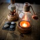 recycled gin bottle tea light holders by Chris Marshall